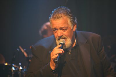 Rafi Ginat singing on a concert